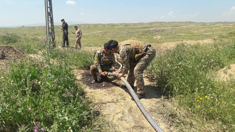 Police forces in Kirkuk confiscate two trucks in the site of an oil robbing, April 18, 2019. (Photo: Energy Police in Kirkuk)